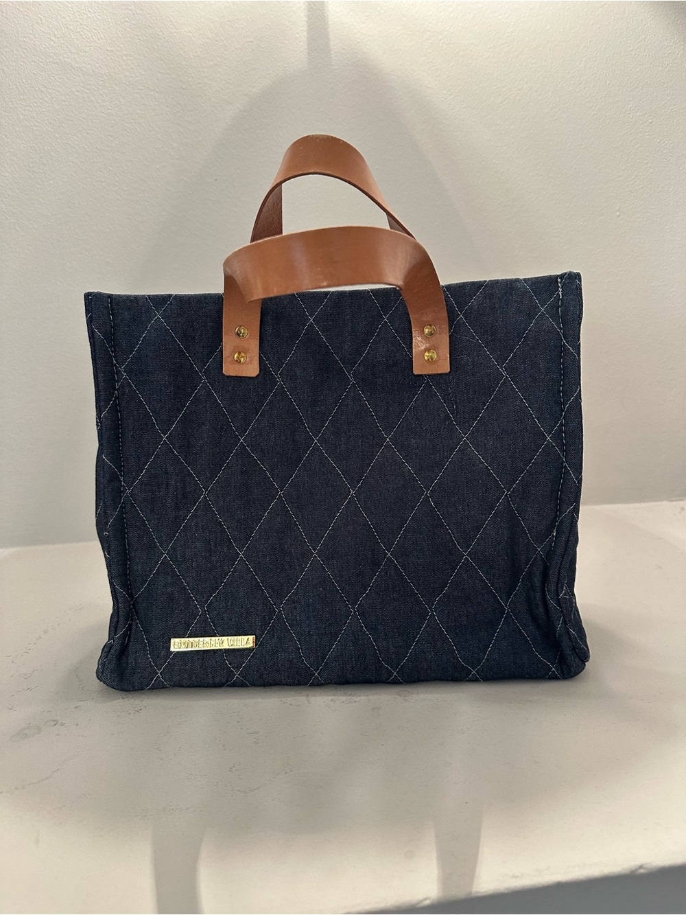 Butterfly Villa, small quilted denim tote with leather handles.